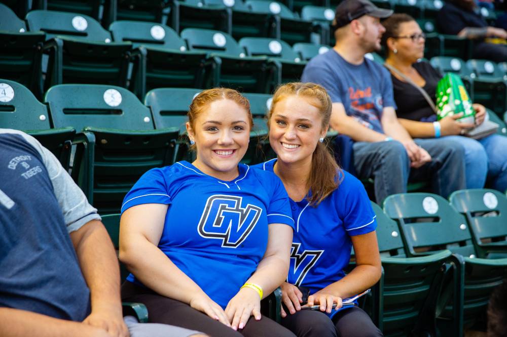 Photo of two young women in the stands at Comerica Park